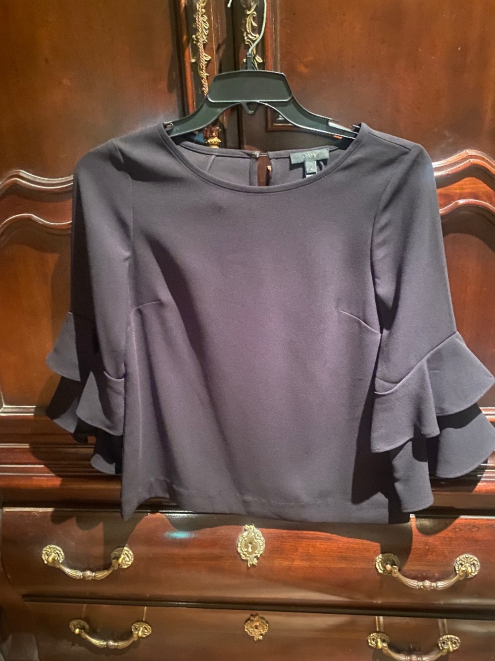 Upscale crepe top with flounce-tiered sleeves